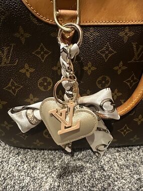 Louis Vuitton Repurposed LV Zipper Pull/ charm on unbranded faux leather heart.